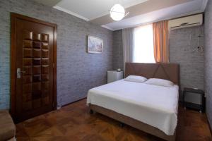 Letto o letti in una camera di Hotel Smile