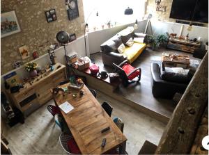 an overhead view of a living room with a couch and a table at La Vignalié in Orban