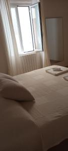 Katil atau katil-katil dalam bilik di Il porto di Ale e Kat