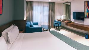 TV a/nebo společenská místnost v ubytování Boulevard Hotel Oman