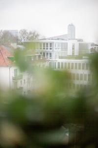 a blurry picture of a building in a city at CenterApartment, WIFI, SmartTV, full Kitchen, Netflix, Pottbude in Essen in Essen