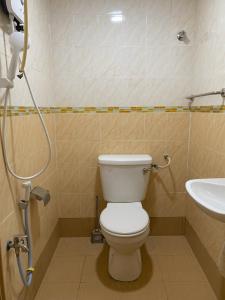 a bathroom with a toilet and a sink at Smart Budget Hotel - Klang in Klang