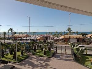 a view of a shopping mall with palm trees at Clarke's Landscape Apartment 303 Gold B Nascente Sombra in Fortaleza