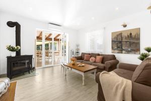 a living room with a couch and a fireplace at Kastelir in Kaštelir