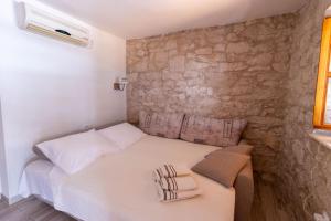 Postel nebo postele na pokoji v ubytování Apartman Điran