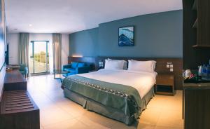 Ένα ή περισσότερα κρεβάτια σε δωμάτιο στο Boulevard Hotel Oman