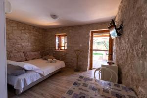 Postel nebo postele na pokoji v ubytování Apartman Điran