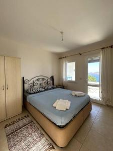 Postel nebo postele na pokoji v ubytování Somos Flats - Yalıkavak