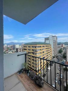 a balcony with a view of a city at Batumi house in Salibauri