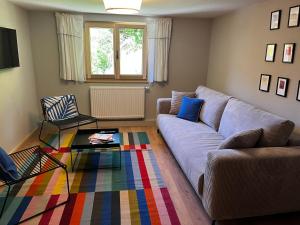 a living room with a couch and a table at Ferienwerk in Ofterschwang