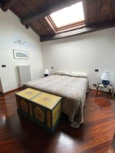 a bedroom with a bed and a skylight at San Marino Skyline - Suite Virgilio in San Marino