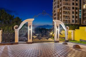 a gate in a city at night at Luxury apartment close to the city centre in Chişinău