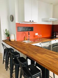 Kuchyňa alebo kuchynka v ubytovaní CASA DAHLIA - Charmant appartement équipé avec grande terrasse