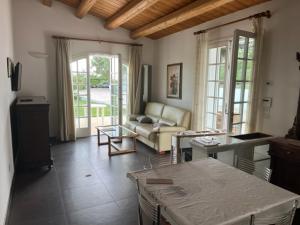 a living room with a couch and a table at SeeConero home in Ancona