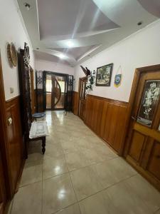 a hallway of a home with wooden doors at Гостевой дом in Ciorescu