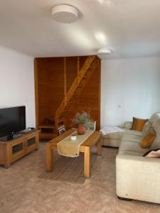a living room with a couch and a table at Tomasova kuća in Križevci
