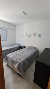 Posteľ alebo postele v izbe v ubytovaní Apartamento encantador na Praia das Astúrias