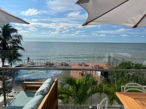 a view of the ocean from the balcony of a resort at Resort Playa Azul Departamentos frente al mar in Tonsupa