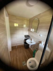a small bathroom with a toilet and a sink at Apartman BANJA in Višegrad
