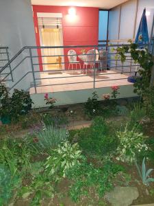 a balcony of a house with two chairs and a table at Apartma Kaj in Kaja in Maribor