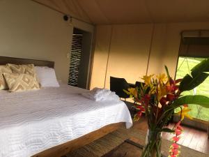 Glamping Las Rocas客房内的一张或多张床位
