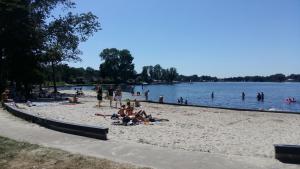 a group of people on a beach near a lake at Drenthse-Groninger landschap in Haren