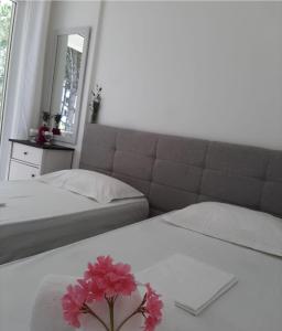 Ένα ή περισσότερα κρεβάτια σε δωμάτιο στο Alex's Condo