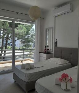 Ένα ή περισσότερα κρεβάτια σε δωμάτιο στο Alex's Condo