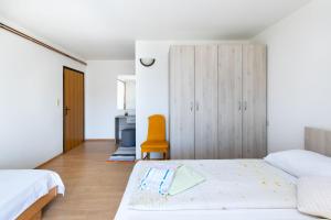 Postel nebo postele na pokoji v ubytování Apartments Boza