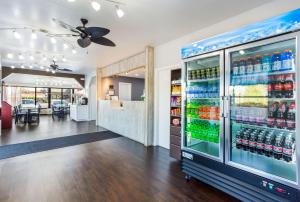 a large refrigerator filled with drinks in a restaurant at Econo Lodge Lebanon in Lebanon