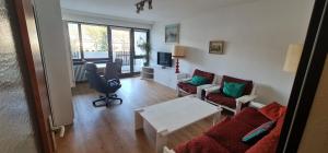a living room with a couch and a table at Apartment Panorama in Bad Reichenhall