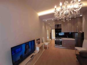 a living room with a large flat screen tv on a wall at Sea View Apartment with Veranda Beach Amazing in Vlorë