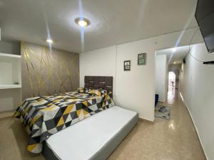 Llit o llits en una habitació de Apartaestudio LONG Vipasa