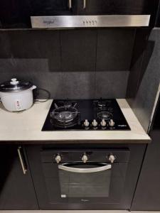 a kitchen with a stove with a pot on it at Stunning Two-Bedroom: Perfect Home Away from Home in Suva