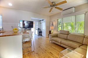 a living room with a couch and a table at Gulfside Resort. Unit 1 in St Pete Beach