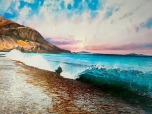 uma pintura de uma onda numa praia em Breakaway Esperance em Esperance