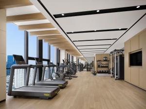 a gym with treadmills and cardio equipment in a building at Courtyard by Marriott Sejong in Sejong