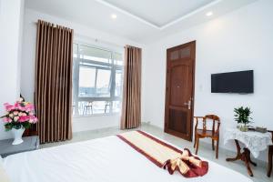 TV a/nebo společenská místnost v ubytování Tuấn An Hotel
