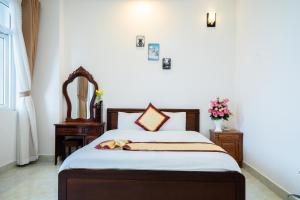 Postel nebo postele na pokoji v ubytování Tuấn An Hotel