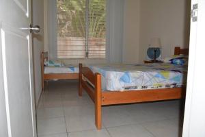 Postel nebo postele na pokoji v ubytování Casa Playa Tonsupa Tu paraíso frente al mar Internet Alta Velocidad Smart TV Netflix