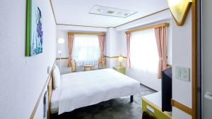 Postel nebo postele na pokoji v ubytování Toyoko Inn Shonan Hiratsuka eki Kita guchi No 1