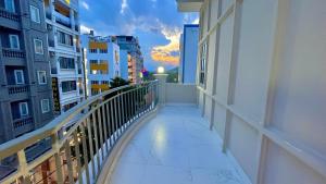 a balcony with a view of a city at sunset at Bamboo Hotel Vung Tau in Vung Tau