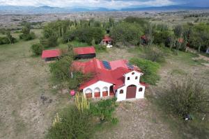 an aerial view of a house with a red roof at El Peñon De Constantino - Tatacoa in Villavieja
