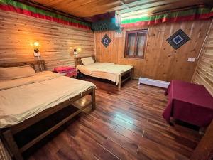 Tavern Hostel仁和客栈客房内的一张或多张床位