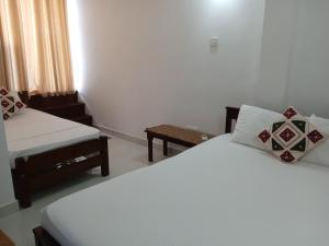 Letto o letti in una camera di Alex Home Stay
