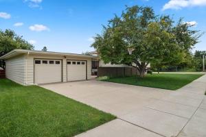a house with a garage and a driveway at Mid-Century Magic - HUGE Space in Rapid City