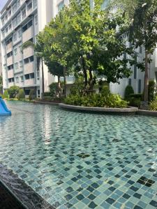 a swimming pool in front of a building at Bohemian Bali style in Hua Hin