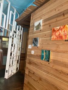 a wall in a building with paintings on it at Surfer's Cafe& Hostel in Chatan +30 photos