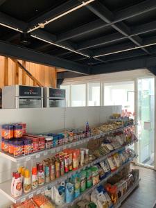 a room with shelves filled with food in a store at Aventree Homestay in Malang