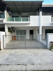 a white building with a fence in front of it at 2 Storey, Hijayu 3D Alconix, Sendayan, Seremban in Seremban
